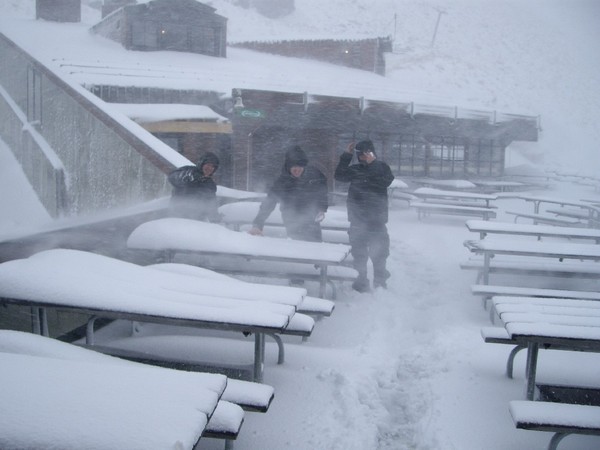 Staff embrace the wintry weather on the deck at The Remarkables Taken mid morning and we have since received another 5cm plus.